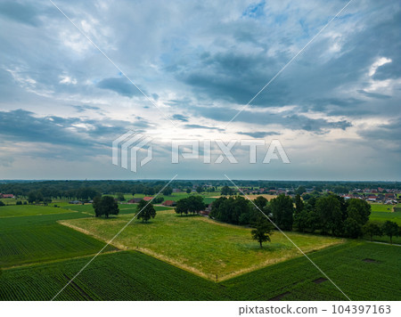 Aerial view of dramatic storm clouds over farm fields. Country landscape of the bad weather. Very 104397163