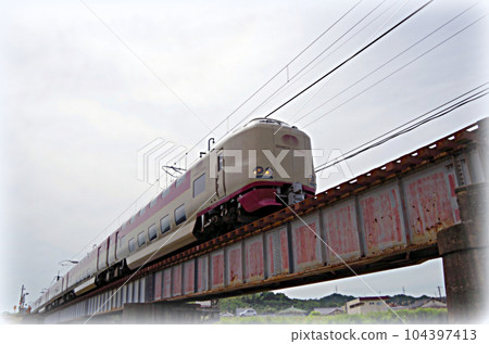 Sleeper limited express Sunrise Izumo crossing the iron bridge in the morning (illustration style) 104397413