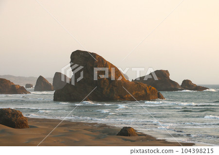 Beautiful rocky Oregon coast and sunset, landscape. 104398215