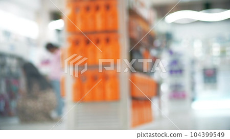 Sun protection creams or sunscreen in a defocused pharmacy Sun protection creams or sunscreen in a defocused pharmacy 104399549