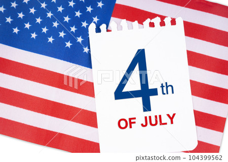 The 4 th July calendar with part of an American flag on white background.USA Independence Day date. 104399562