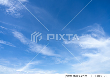 Blue sky and white cirrocumulus clouds texture background. Blue sky on sunny day. Summer sky. Cloud formation. Fluffy clouds. Nice weather in summer season. Weather pattern. Atmospheric phenomenon. Blue sky and white cirrocumulus clouds texture background. Blue sky on sunny day. Summer sky. Cloud formation. Fluffy clouds. Nice weather in summer season. Weather pattern. Atmospheric phenomenon. 104403129