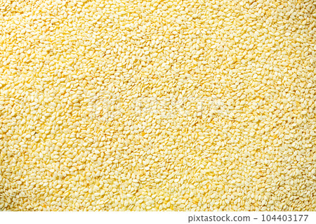 Top view pile of organic white sesame seeds. Top view pile of organic white sesame seeds. 104403177