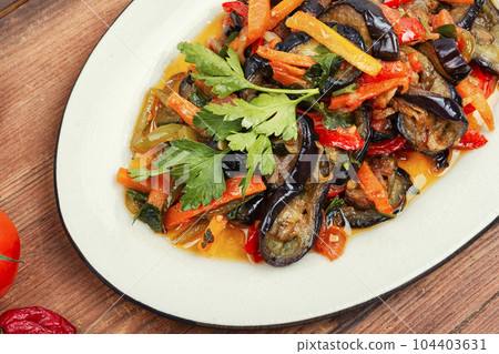 Aubergine saute, tasty vegetable stew. Aubergine saute, tasty vegetable stew. 104403631