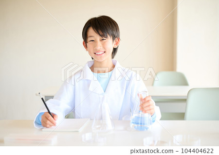 Elementary school boy doing science experiments Elementary school boy doing science experiments 104404622