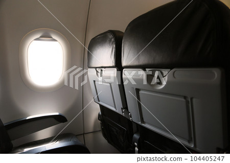 Seat inside of the plane and window space. The air line support traveler for journey to someplace. Low cost airline in domestic. 104405247