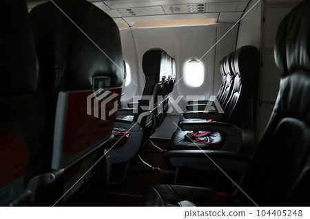Seat inside of the plane and window space. The air line support traveler for journey to someplace. Low cost airline in domestic. 104405248
