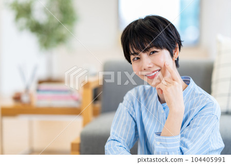 A woman checking her skin condition. 104405991