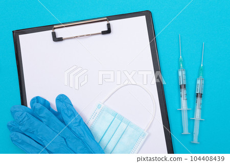 Vaccination or Revaccination Concept - Two Medical Syringe on Blue Table 104408439