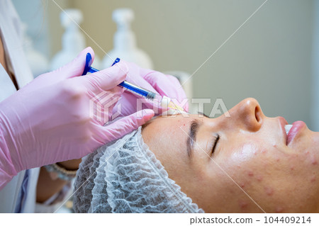 Treatment of skin in cosmetology for female, professionals injections for woman client in clinic. 104409214