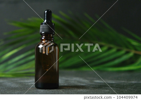 Drop of clear liquid, oil, serum or tincture 104409974