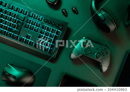Blue lit keyboard with various wireless devices Blue lit keyboard with various wireless devices 104410963