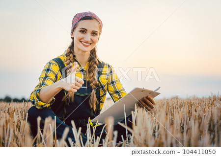 Farmer having harvest finished showing thumps-up Farmer having harvest finished showing thumps-up 104411050