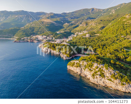 Queen's Beach in Milocer, Montenegro. Aerial view of sea waves and fantastic Rocky coast, Montenegro. drone 104411273