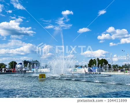 Fountain park in Warsaw, Poland, blue sky, summer time Fountain park in Warsaw, Poland, blue sky, summer time 104411899