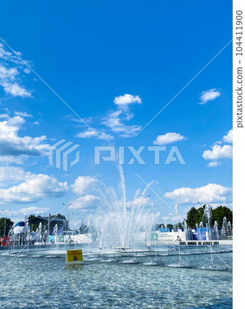Fountain park in Warsaw, Poland, blue sky, summer time Fountain park in Warsaw, Poland, blue sky, summer time 104411900