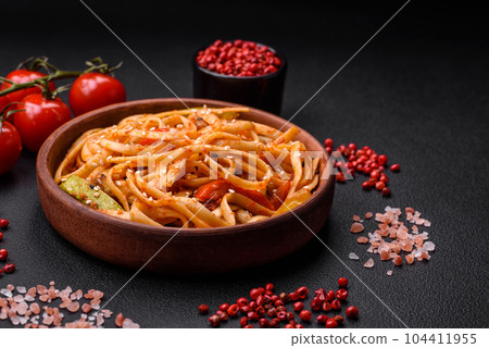 Delicious asian udon dish with vegetables, mushrooms, salt and spices Delicious asian udon dish with vegetables, mushrooms, salt and spices 104411955