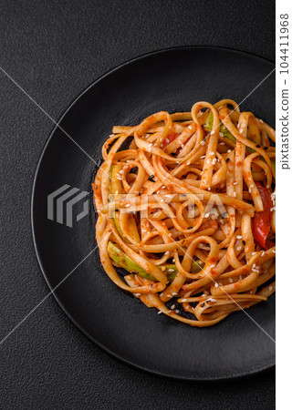 Delicious asian udon dish with vegetables, mushrooms, salt and spices Delicious asian udon dish with vegetables, mushrooms, salt and spices 104411968