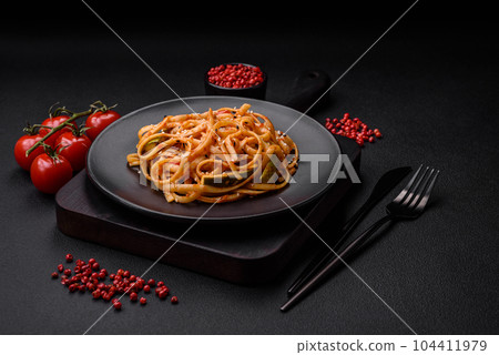 Delicious asian udon dish with vegetables, mushrooms, salt and spices Delicious asian udon dish with vegetables, mushrooms, salt and spices 104411979