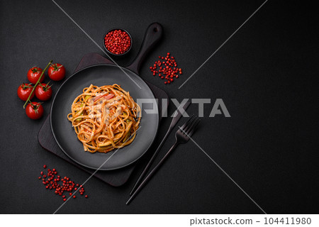Delicious asian udon dish with vegetables, mushrooms, salt and spices 104411980