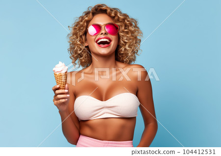 Happy sexy woman eating ice cream, adult girl having fun in summer 104412531