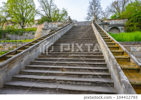 Historical baroque staircase with water cascades on each side and Triton sculptures on the top. Kuks, Czech Republic 104412793