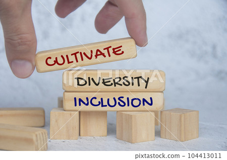 Cultivate diversity and inclusion text on wooden blocks. Respecting diversity concept. 104413011