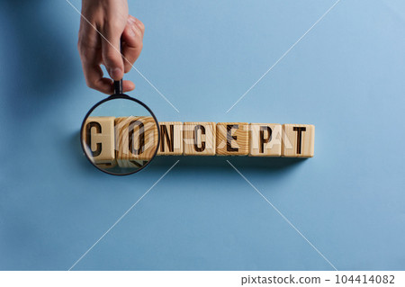 Realistic wooden blocks with concept word on blue table 104414082