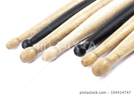 many drum sticks of two colors of black and white isolates 104414747