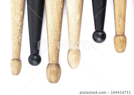many drum sticks of two colors of black and white isolates 104414751