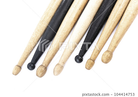 many drum sticks of two colors of black and white isolates 104414753