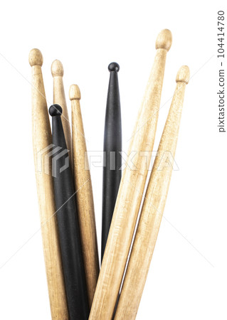 many drum sticks of two colors of black and white isolates 104414780