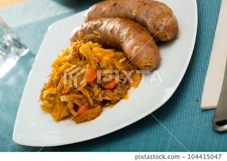 Sausages with stewed cabbage Sausages with stewed cabbage 104415047