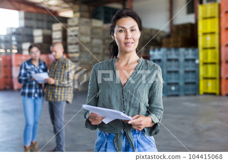 female employee working at the warehouse female employee working at the warehouse 104415068