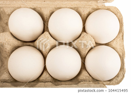 six 6 eggs in a cardboard tray for ten 10 eggs isolate 104415495