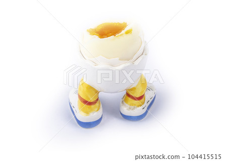 boiled egg open half in stand in the form of legs isolate 104415515