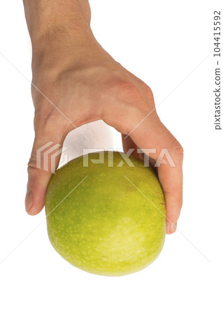 in a hand a green apple isolated on white isolated background 104415592