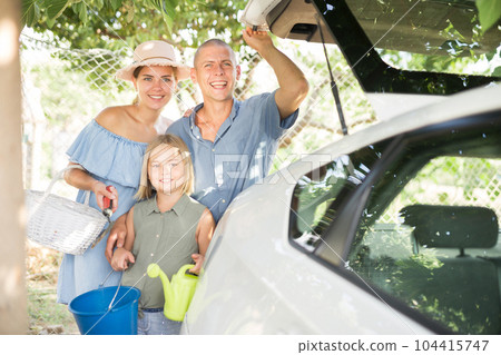 Family beside car Family beside car 104415747