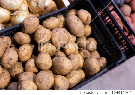 Potatoes in plastic box Potatoes in plastic box 104415764