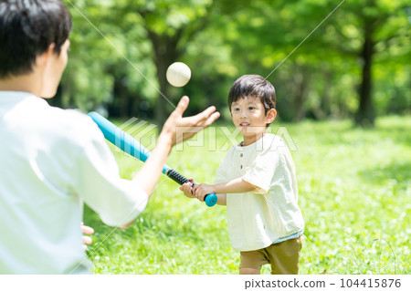 Parents playing balls in the park 104415876