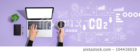 Reduce CO2 theme with person using laptop computer 104416019