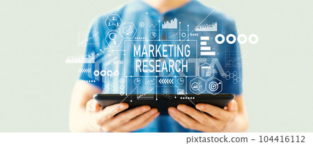 Marketing Research theme with man using a tablet 104416112