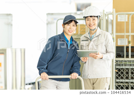 Middle-aged women working in a warehouse Middle-aged women working in a warehouse 104416534