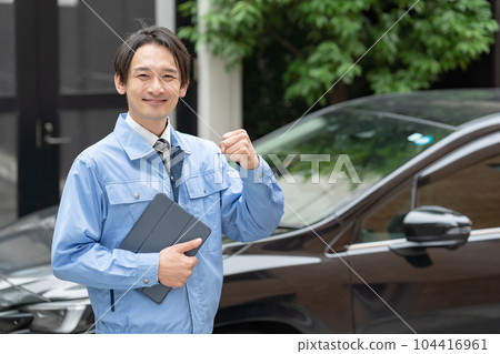 Man in work clothes car inspection 104416961