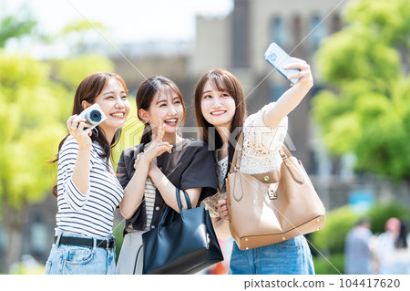 Girls' trip smartphone selfie 104417620