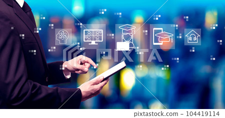 Distance learning theme with businessman using a tablet computer Distance learning theme with businessman using a tablet computer 104419114