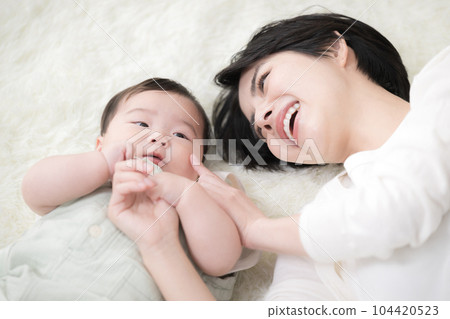 Close-up of mother and cute baby Close-up of mother and cute baby 104420523