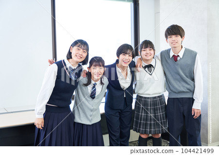 A junior high school student taking a commemorative photo with a teacher A junior high school student taking a commemorative photo with a teacher 104421499