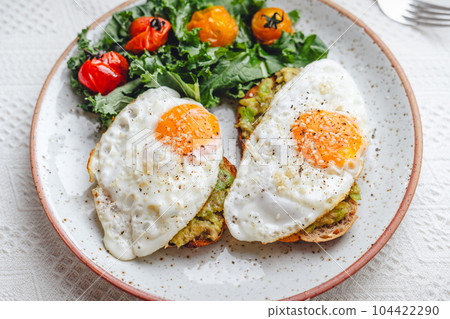 breakfast fried egg avocado toast 104422290