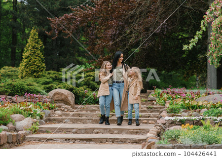 Caucasian stylish family in the same clothes have fun in the spring in the park 104426441
